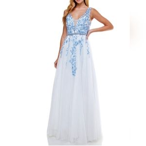 A plunging V-neckline, pretty embroidered appliqués and sprinklings of sparkling